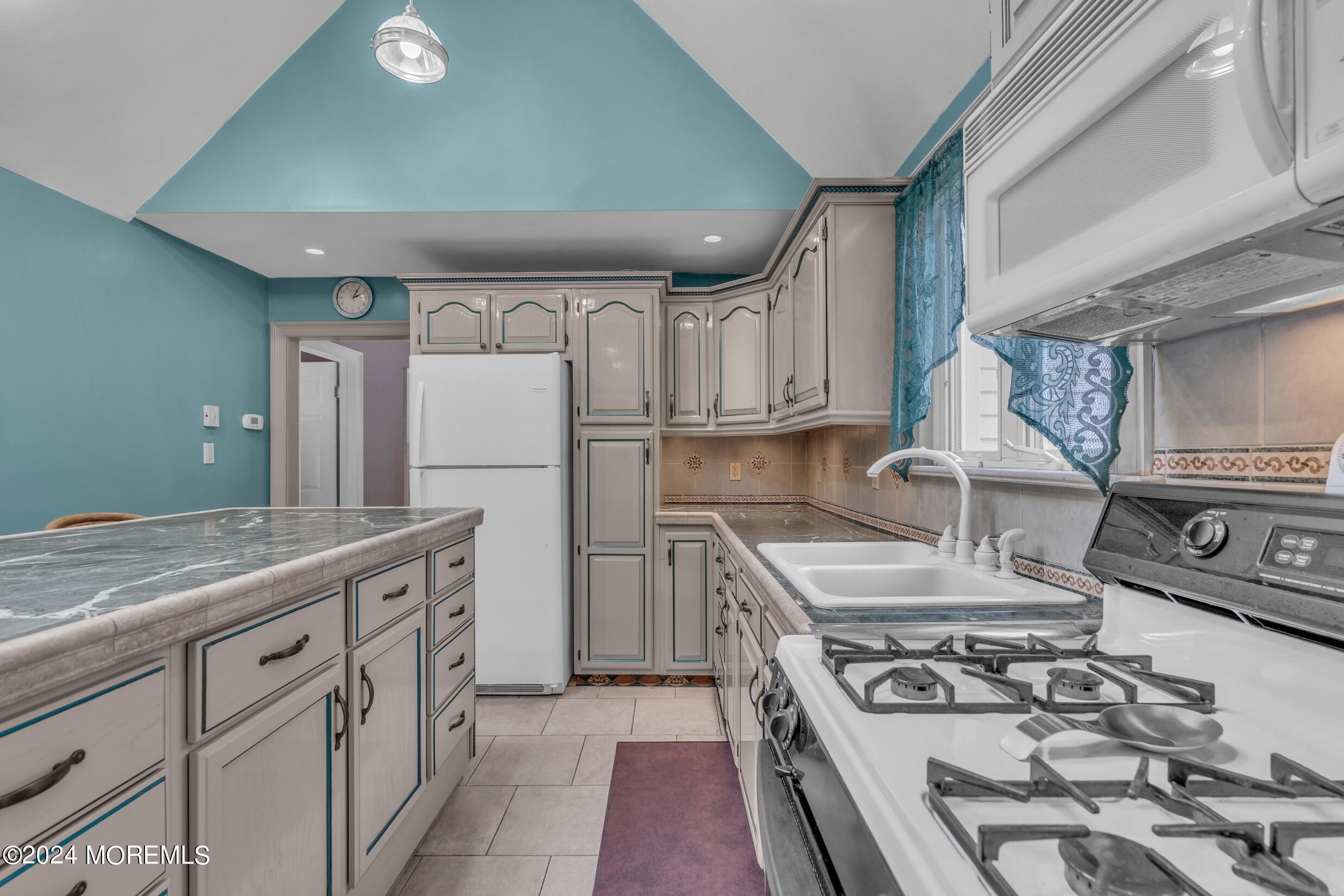 1126 Toms River Road Jackson, NJ 08527 - Photo 4 of 38 a kitchen with stainless steel appliances granite countertop a stove and a refrigerator