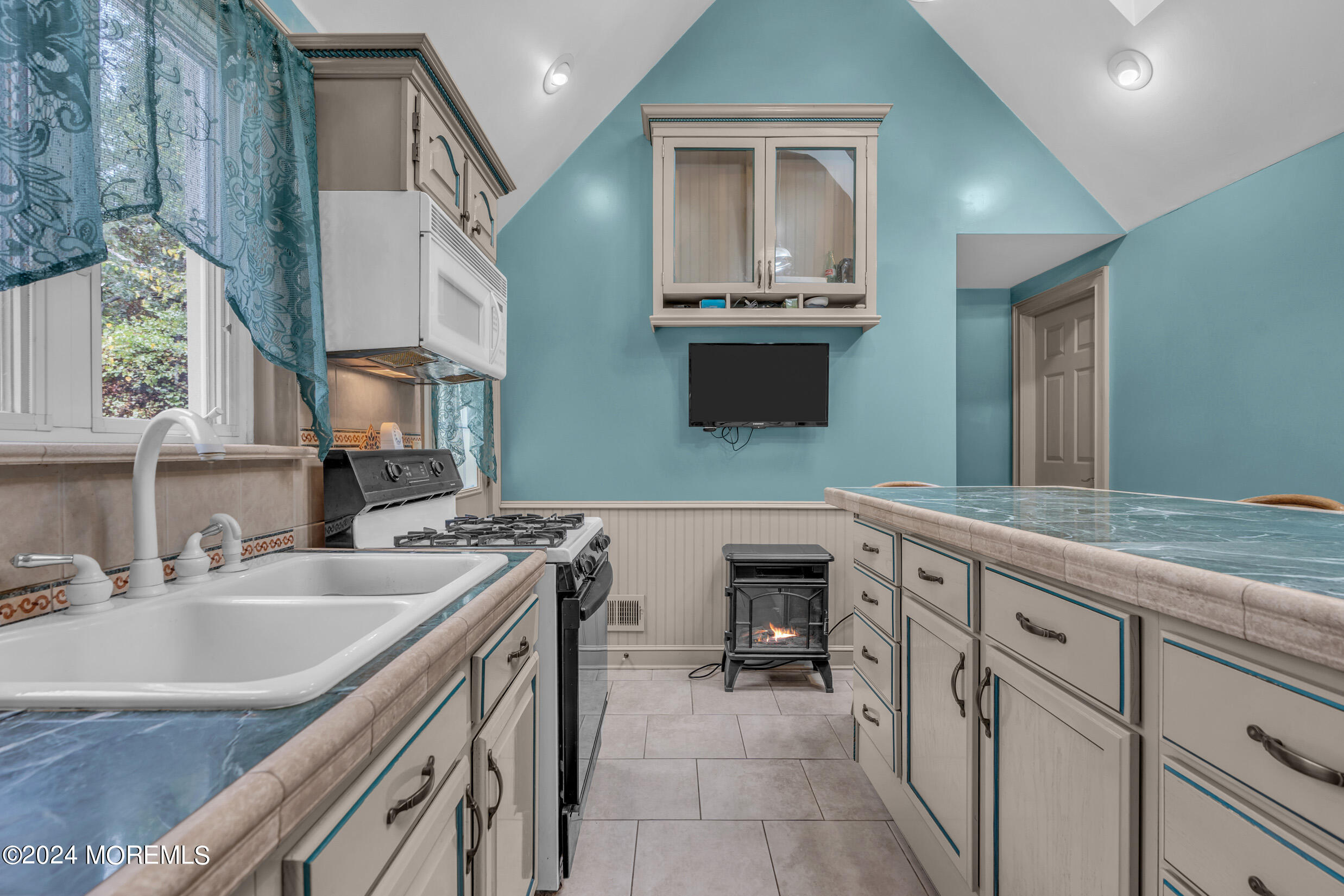 1126 Toms River Road Jackson, NJ 08527 - Photo 7 of 38 a kitchen with a sink stove and cabinets