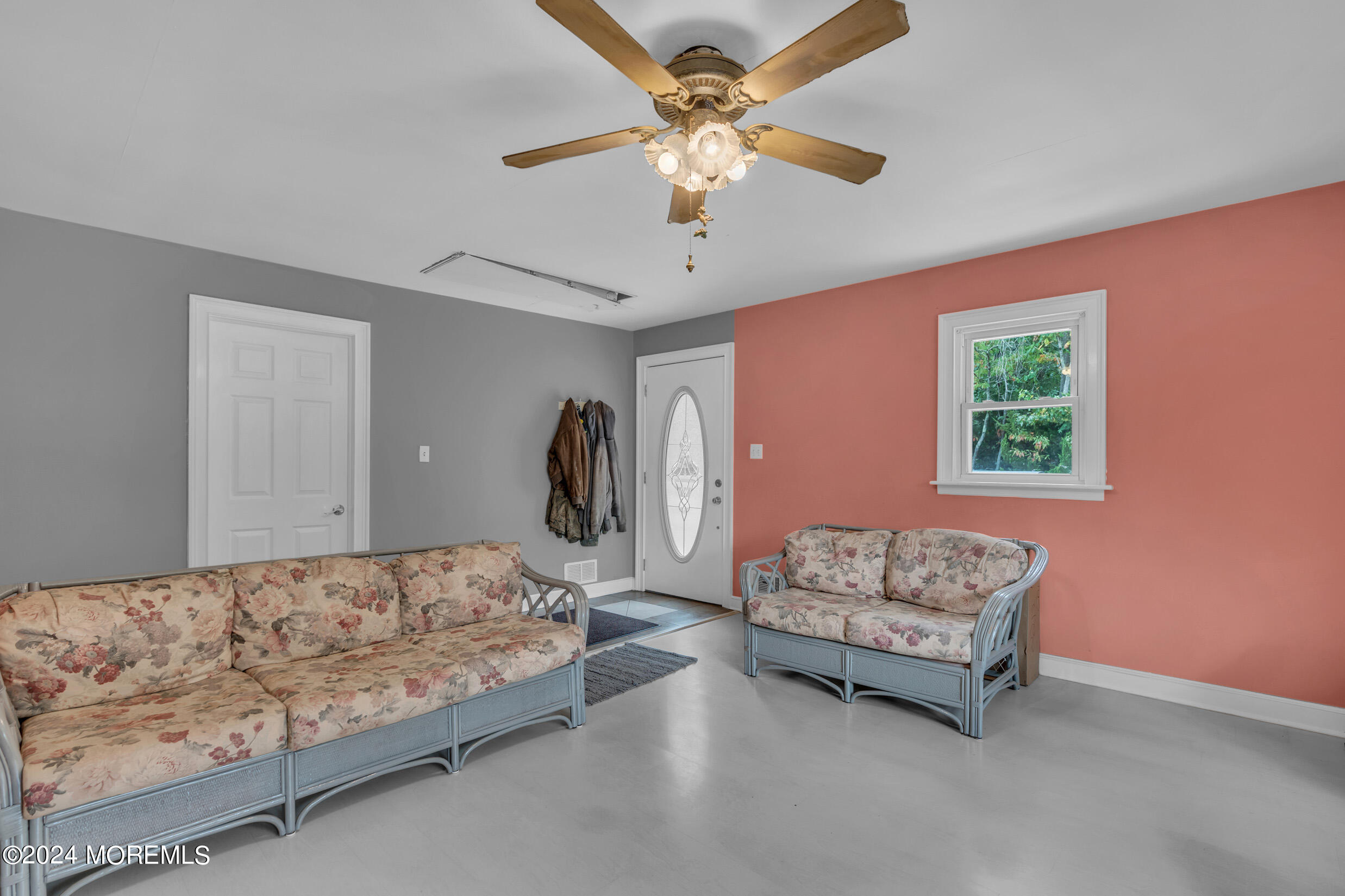 1126 Toms River Road Jackson, NJ 08527 - Photo 10 of 38 a bedroom with bed and a couch