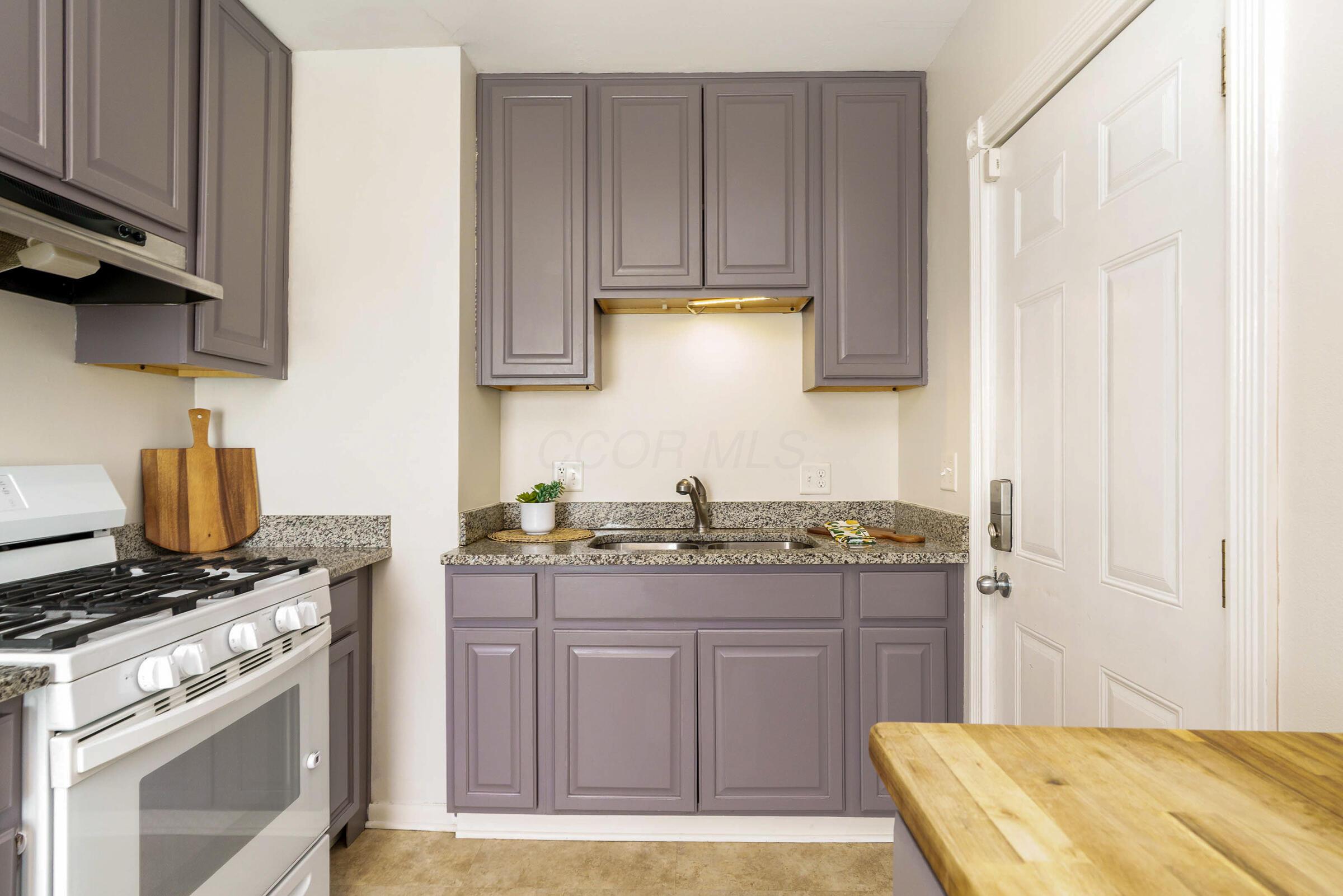 2780 Audubon Road Columbus, OH 43211 - Photo 9 of 32 The updated eat-in kitchen features granite and butcher block counters, 42" cabinetry and updated appliances.