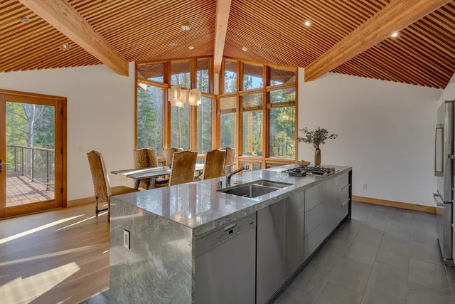 a kitchen with a sink and large window