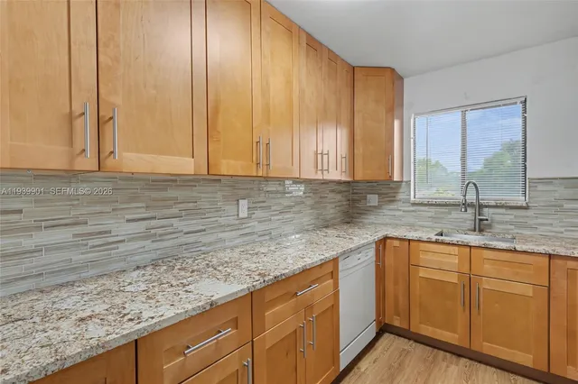 a kitchen with a stove and a microwave