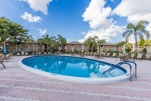 a front view of a house with a garden and plants