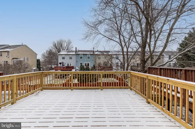 a view of a balcony with wooden fence