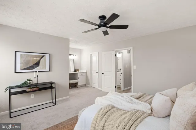 a bedroom with a bed and a desk