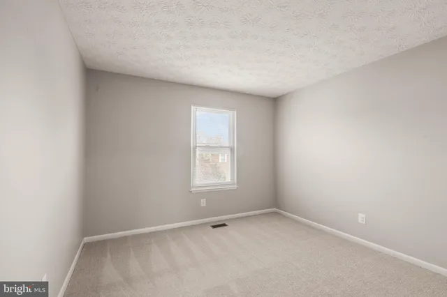 an empty room with window