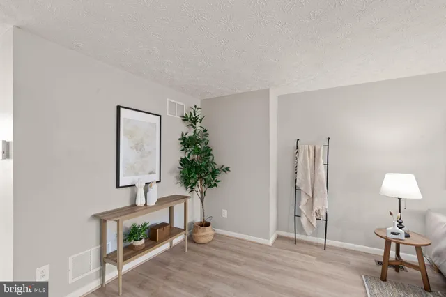 a view of hall way with furniture