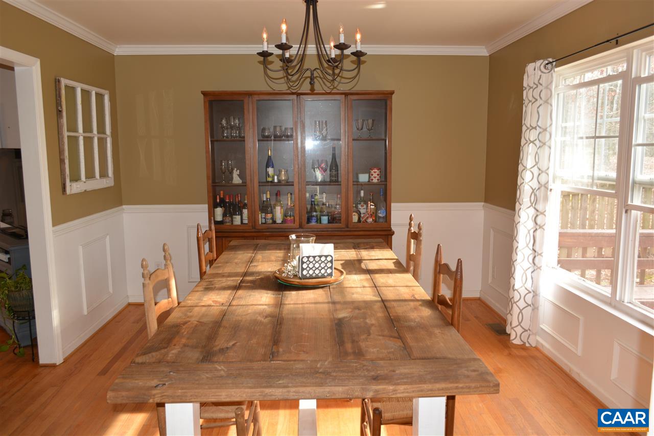 1 Riverside Drive Palmyra, VA 22963 - Photo 8 of 26 a living room with a couch and a chandelier
