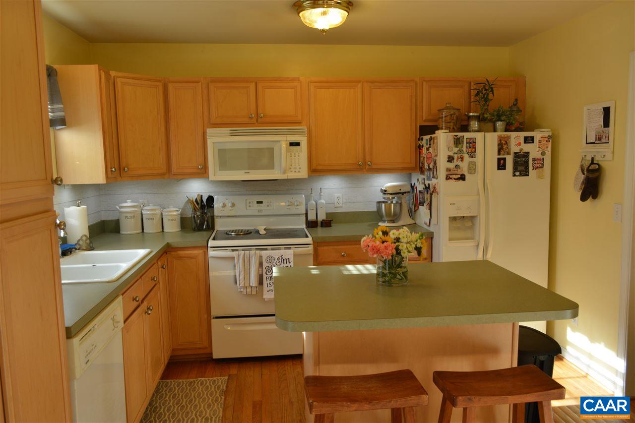 1 Riverside Drive Palmyra, VA 22963 - Photo 9 of 26 a kitchen with a table chairs stove and cabinets
