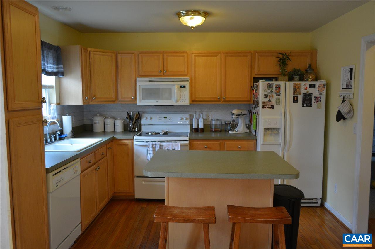 1 Riverside Drive Palmyra, VA 22963 - Photo 10 of 26 a kitchen with stainless steel appliances granite countertop a sink refrigerator and microwave