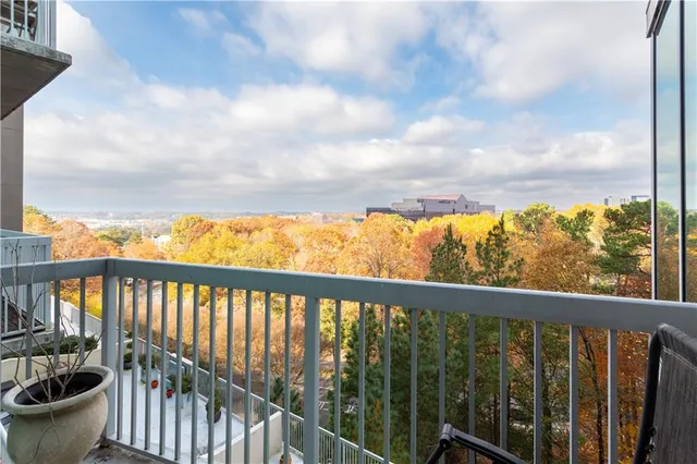 a view of a balcony with an outdoor seating