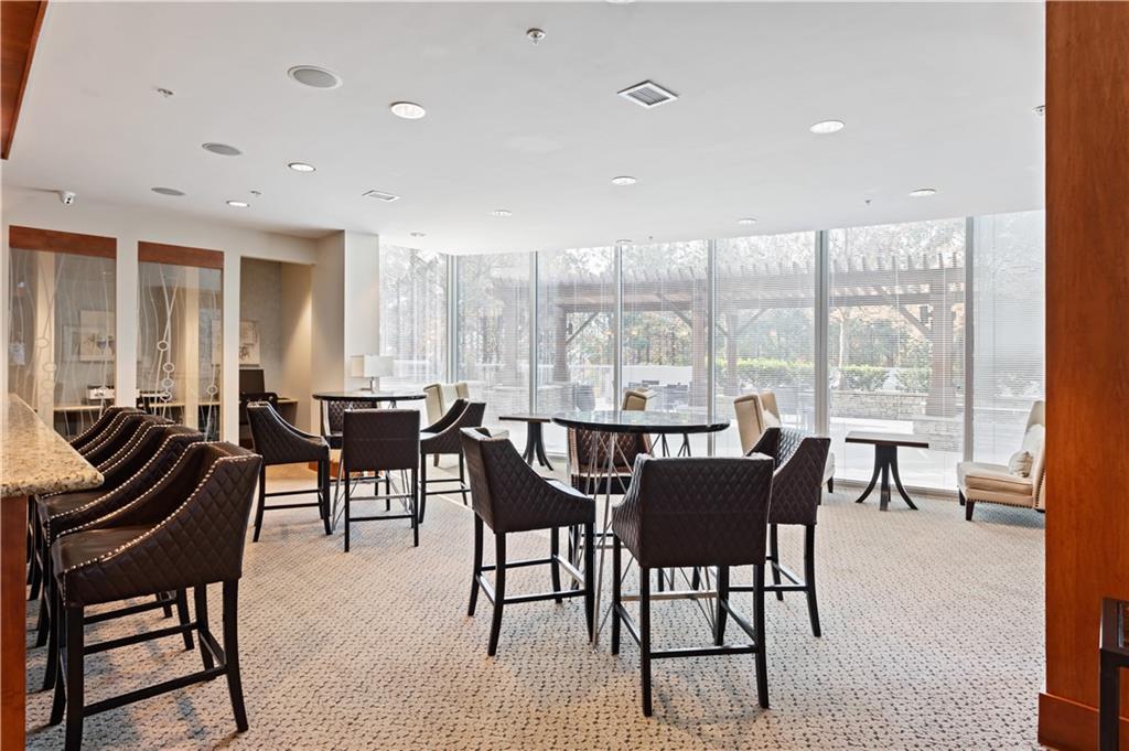 3300 Windy Ridge Parkway Southeast, Unit 713 Atlanta, GA 30339 - Photo 27 of 35 a view of a dining room with furniture window and outside view