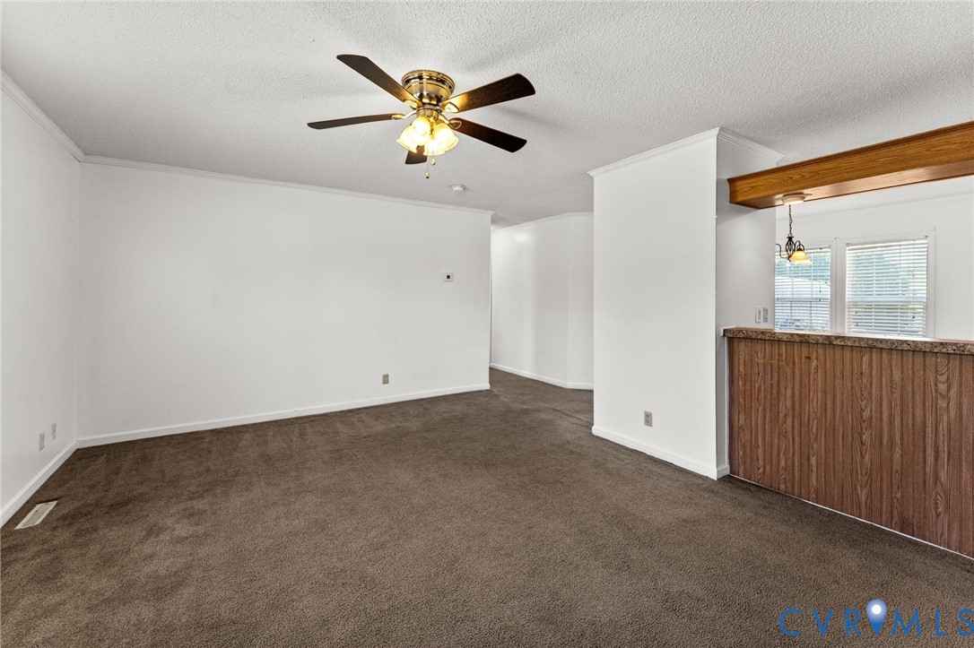 1450 Mt Prospect Road Laneview, VA 22504 - Photo 5 of 25 Living Room open to Kit hen with a bar top. Wall t