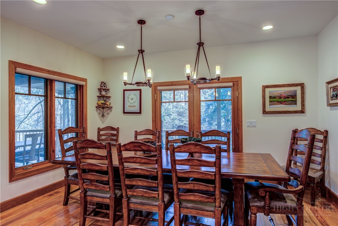 119 Blackberry Lane Boone, NC 28607 - Photo 11 of 41 a view of a dining room with furniture window and wooden floor