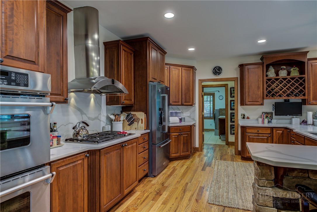 119 Blackberry Lane Boone, NC 28607 - Photo 12 of 41 a kitchen with stainless steel appliances granite countertop a sink stove and refrigerator