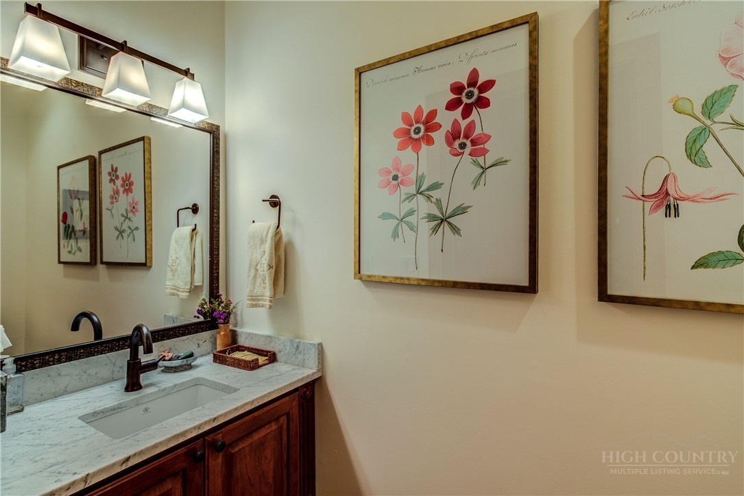 119 Blackberry Lane Boone, NC 28607 - Photo 15 of 41 a view of a bathroom with a sink and a mirror