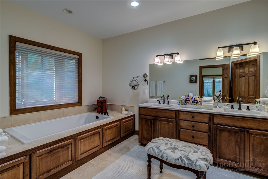 119 Blackberry Lane Boone, NC 28607 - Photo 18 of 41 a bathroom with a sink vanity and mirror