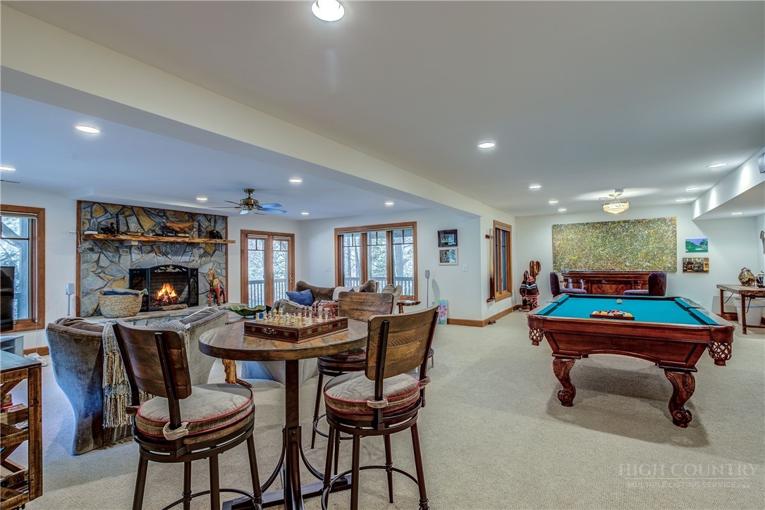 119 Blackberry Lane Boone, NC 28607 - Photo 23 of 41 a outdoor living space with furniture and a fireplace