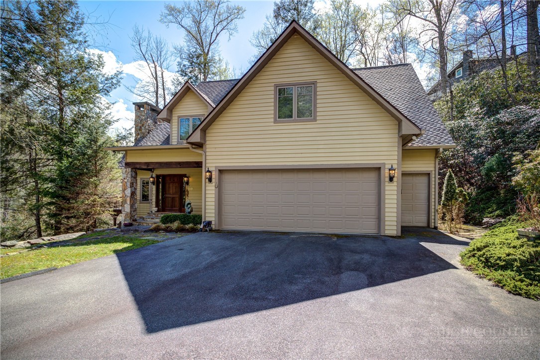 119 Blackberry Lane Boone, NC 28607 - Photo 3 of 41 a front view of house with yard area and tree