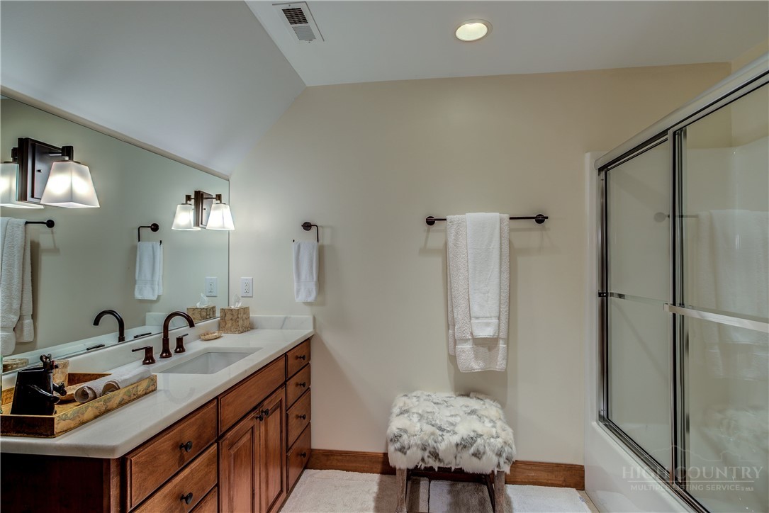 119 Blackberry Lane Boone, NC 28607 - Photo 32 of 41 a bathroom with a sink double vanity and shower