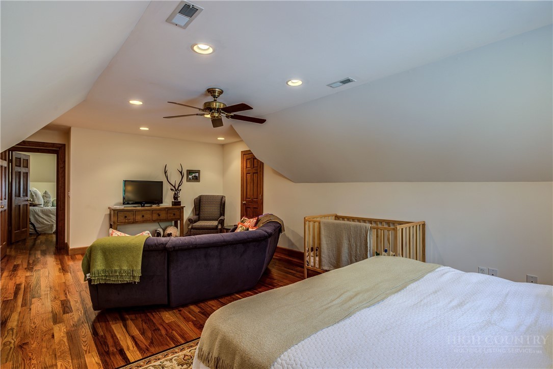 119 Blackberry Lane Boone, NC 28607 - Photo 34 of 41 a bedroom with furniture and a wooden floor