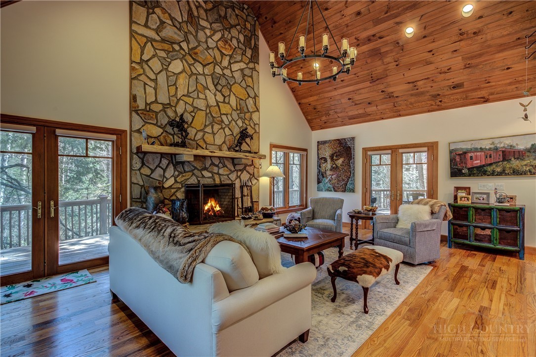 119 Blackberry Lane Boone, NC 28607 - Photo 6 of 41 a living room with furniture and a fireplace