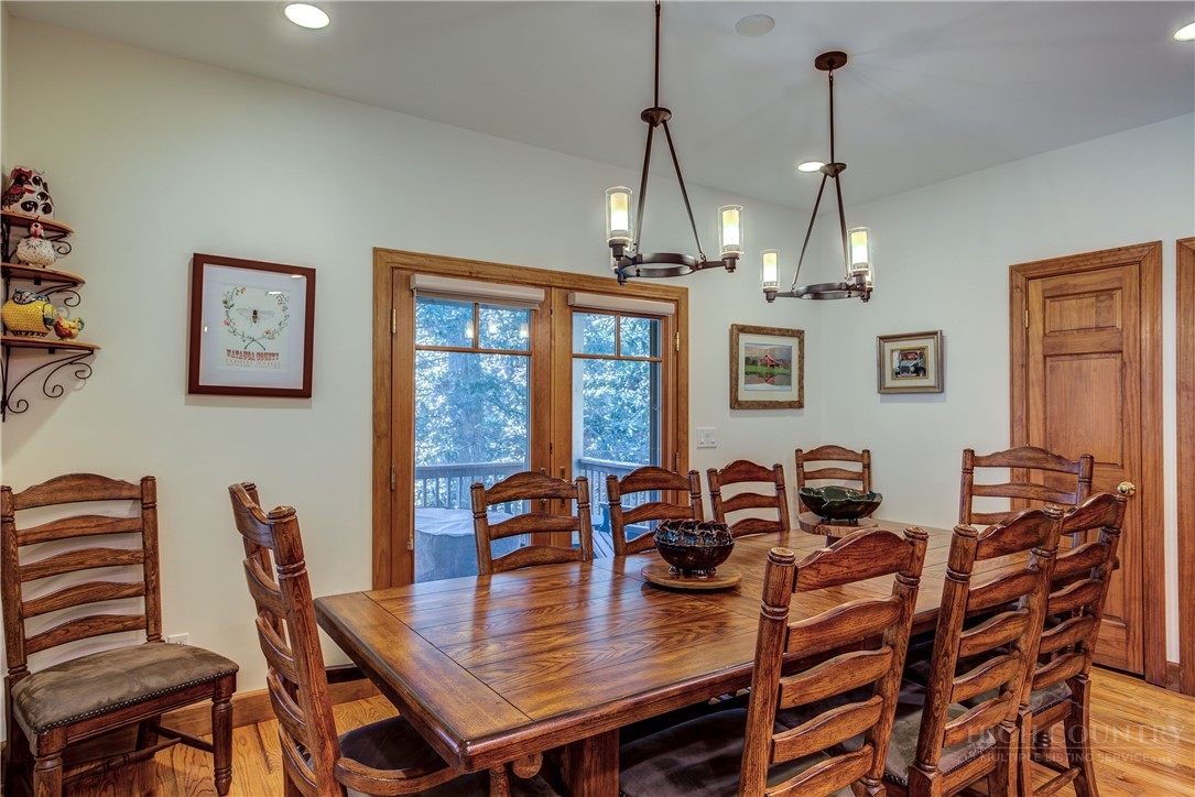 119 Blackberry Lane Boone, NC 28607 - Photo 10 of 41 a view of a dining room with furniture window and wooden floor