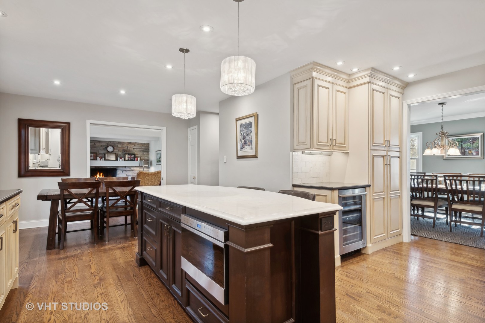 255 Cold Spring Road Barrington, IL 60010 - Photo 11 of 47 a room with a table chairs and a refrigerator