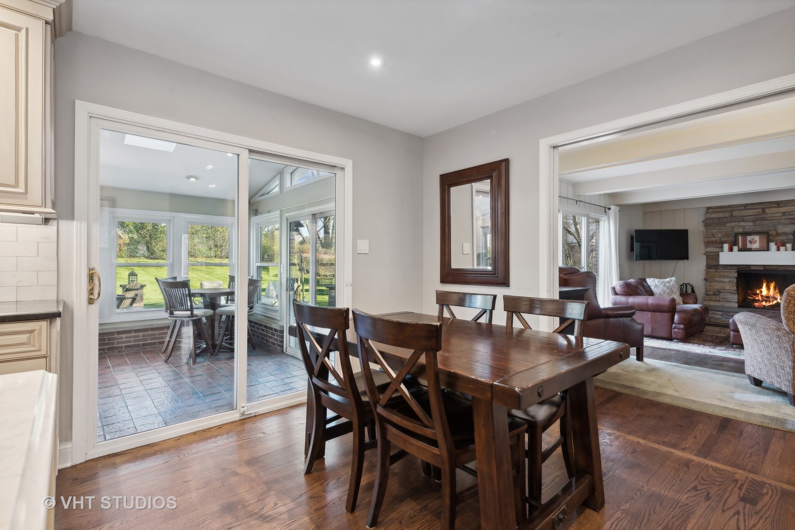 255 Cold Spring Road Barrington, IL 60010 - Photo 15 of 47 a view of a dining room with furniture and a potted plant
