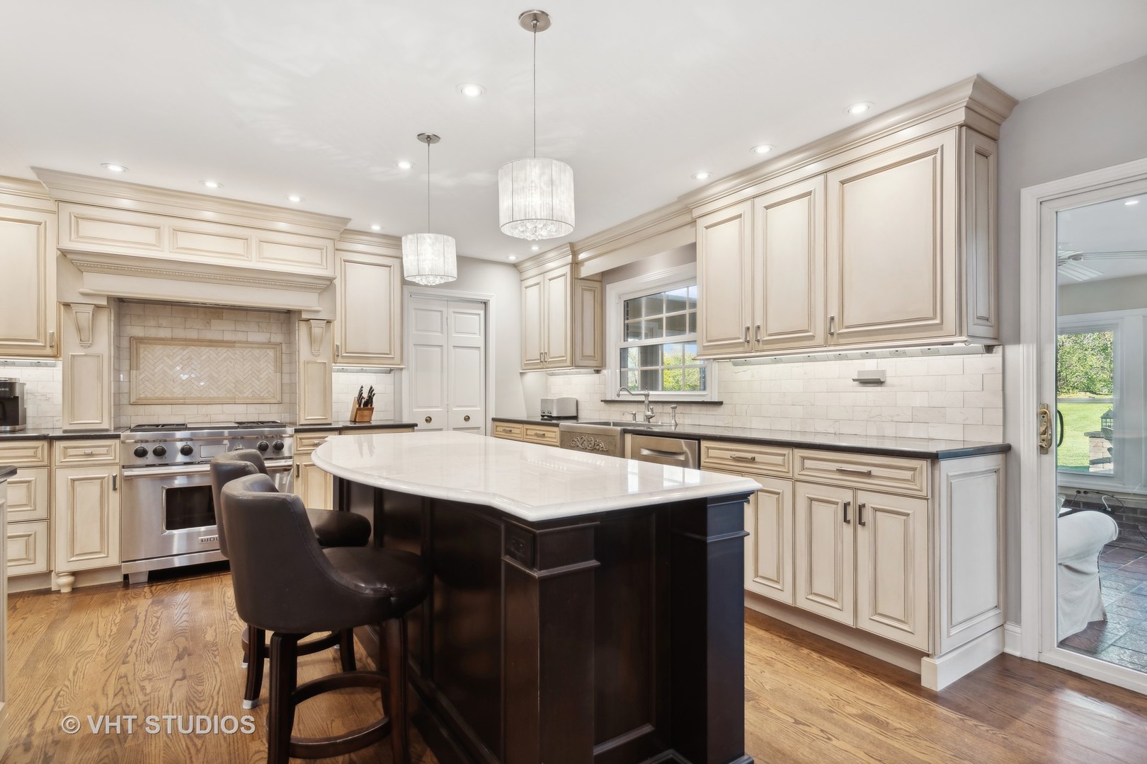 255 Cold Spring Road Barrington, IL 60010 - Photo 9 of 47 a kitchen with kitchen island granite countertop a sink cabinets and wooden floor