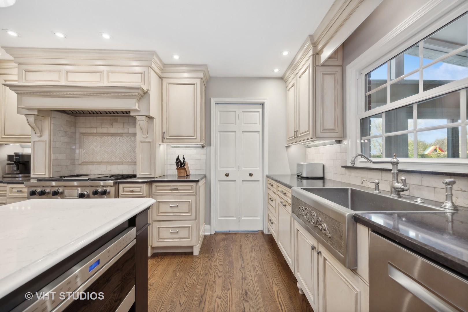 255 Cold Spring Road Barrington, IL 60010 - Photo 10 of 47 a kitchen with stainless steel appliances granite countertop a sink stove and cabinets