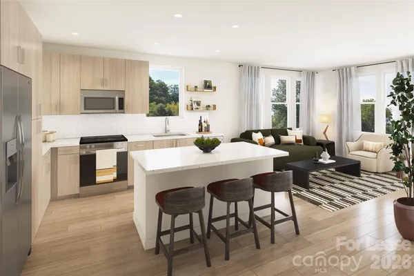a kitchen with a dining table and chairs