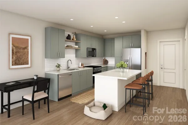 a kitchen with a sink cabinets and wooden floor