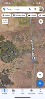 a view of a lake with houses in back