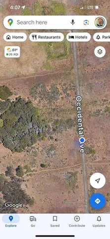 a view of a lake with houses in back