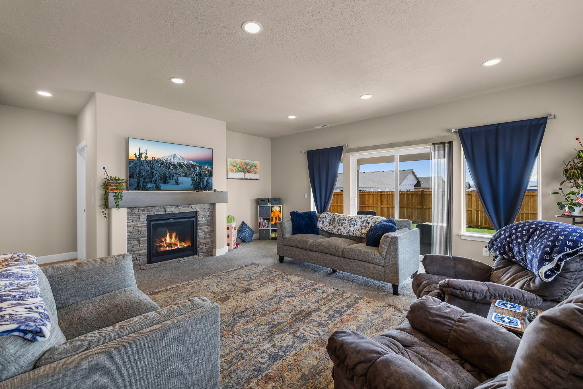 1132 Northwest Golf Course Drive Madras, OR 97741 - Photo 11 of 36 a living room with furniture and a fireplace