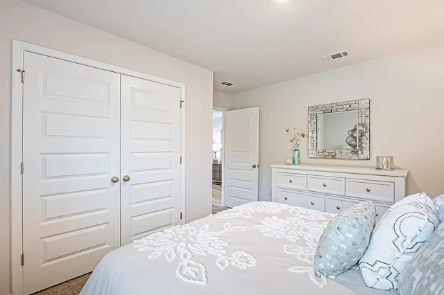 a bedroom with a bed and closet