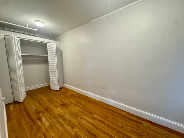 a view of wooden floor in an empty room