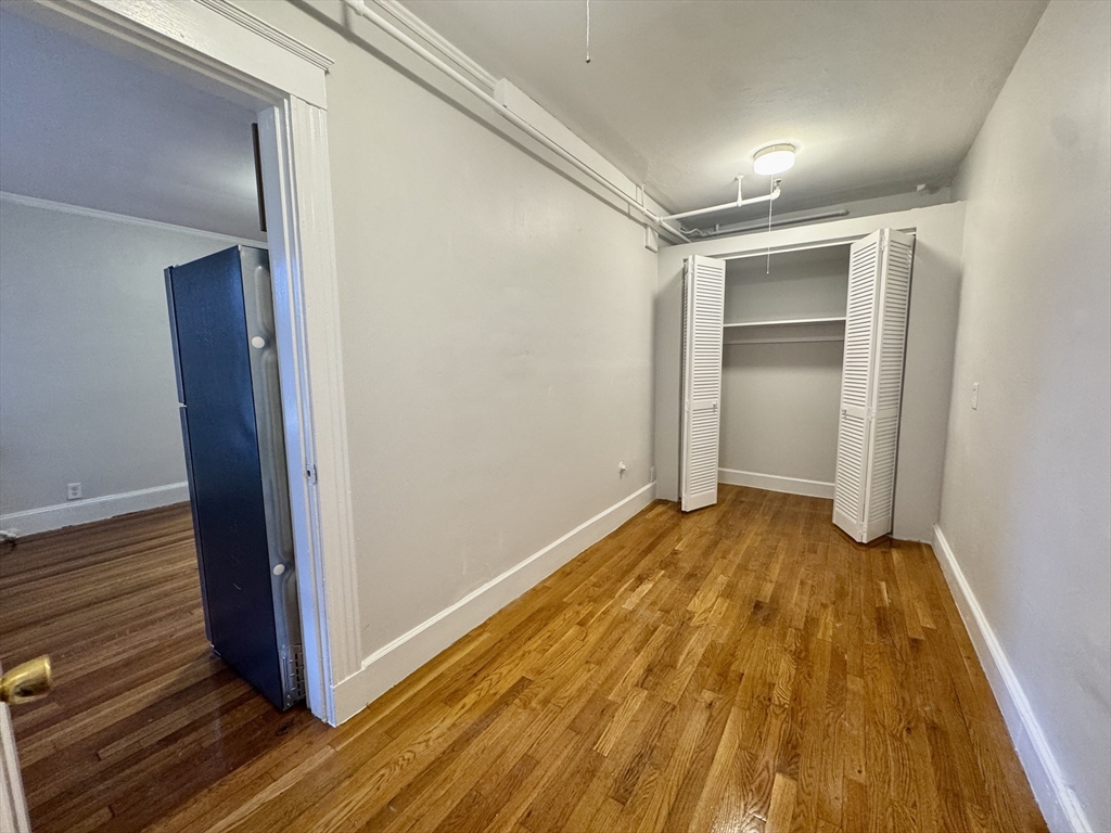 1615 Commonwealth Avenue, Unit 6 Boston, MA 02135 - Photo 8 of 11 a view of wooden floor in an empty room