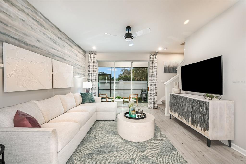 3266 Timber Xing Avenue Brandon, FL 33511 - Photo 11 of 24 a living room with furniture and a flat screen tv