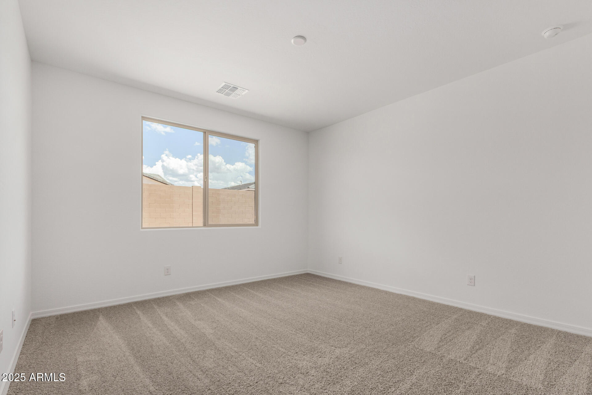 18474 East Dario Road Gold Canyon, AZ 85118 - Photo 11 of 36 an empty room with a window