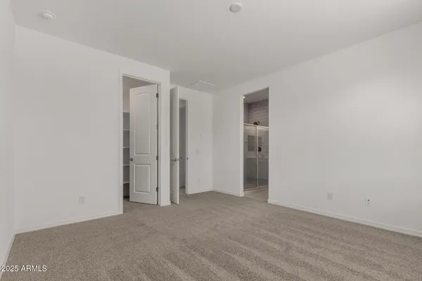 a bathroom with a double vanity sink toilet and a mirror
