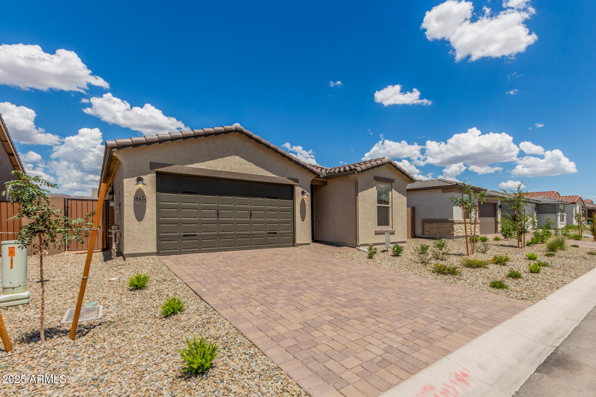 18474 East Dario Road Gold Canyon, AZ 85118 - Photo 33 of 36 a front view of a house with a yard and garage