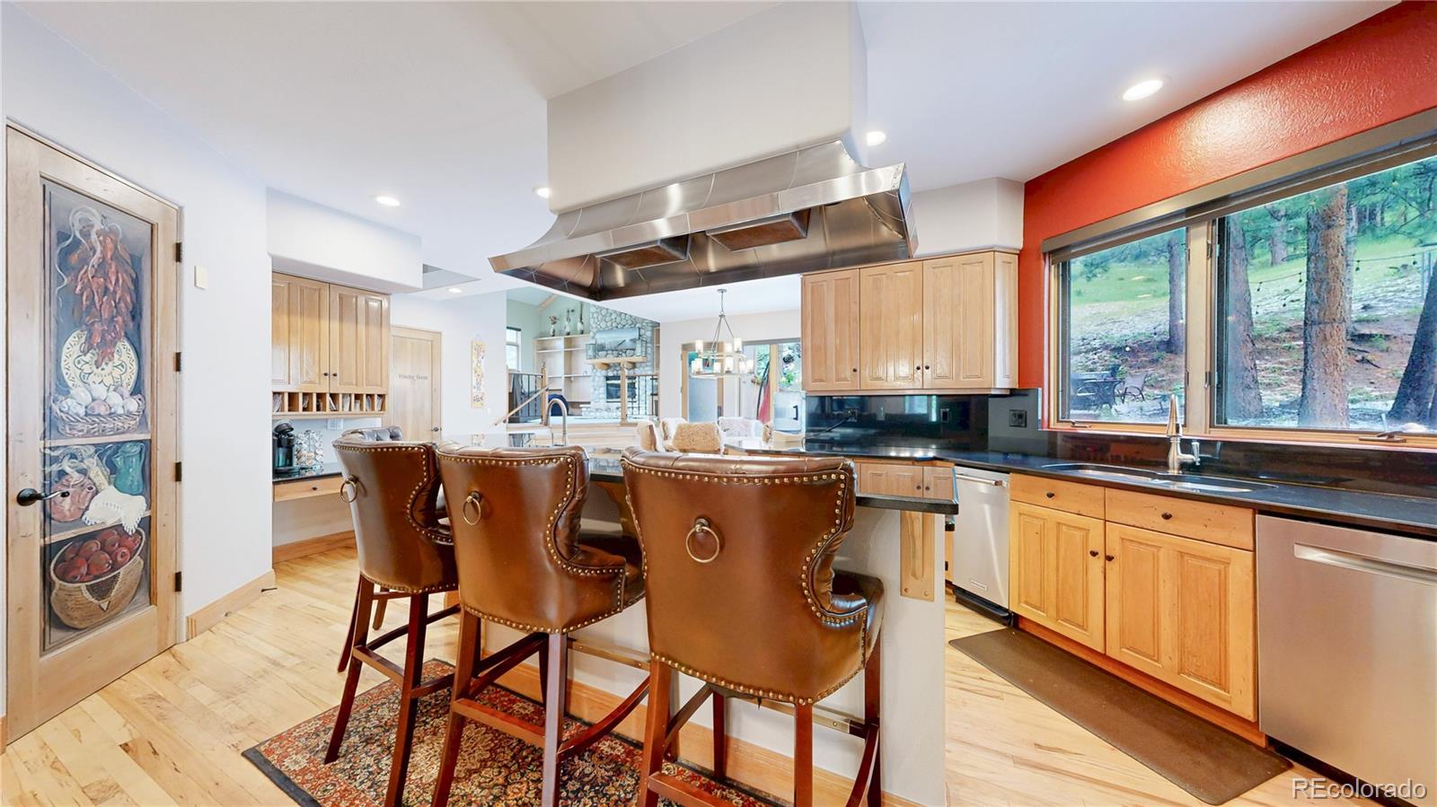 974 Spring Ranch Drive Golden, CO 80401 - Photo 13 of 50 a large kitchen with a table and chairs in it