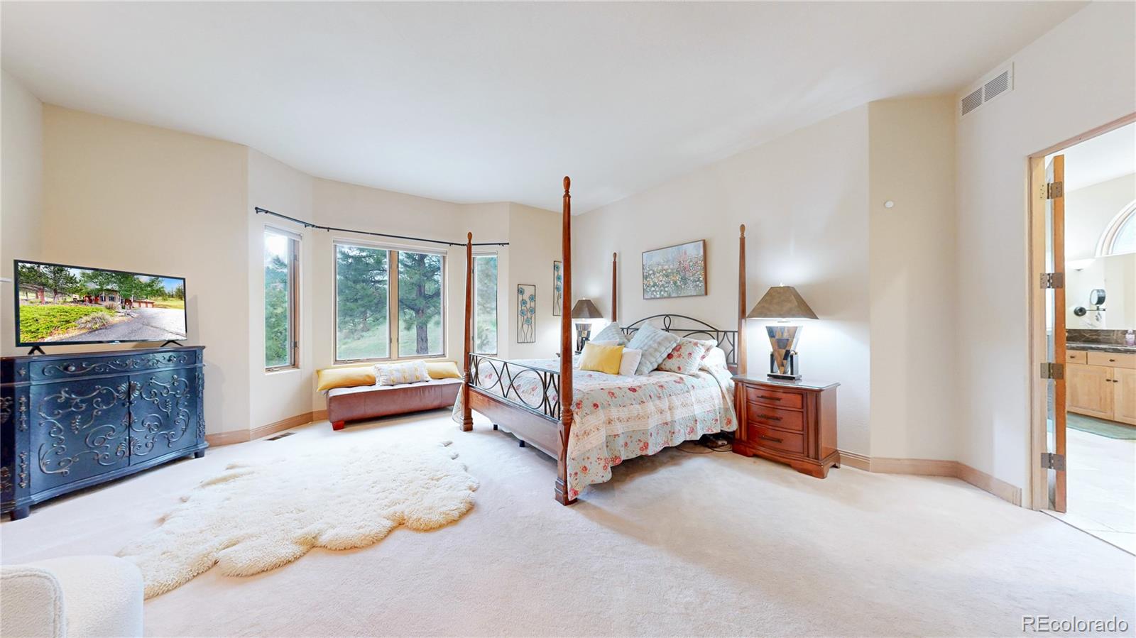 974 Spring Ranch Drive Golden, CO 80401 - Photo 18 of 50 a bed room with furniture and a window