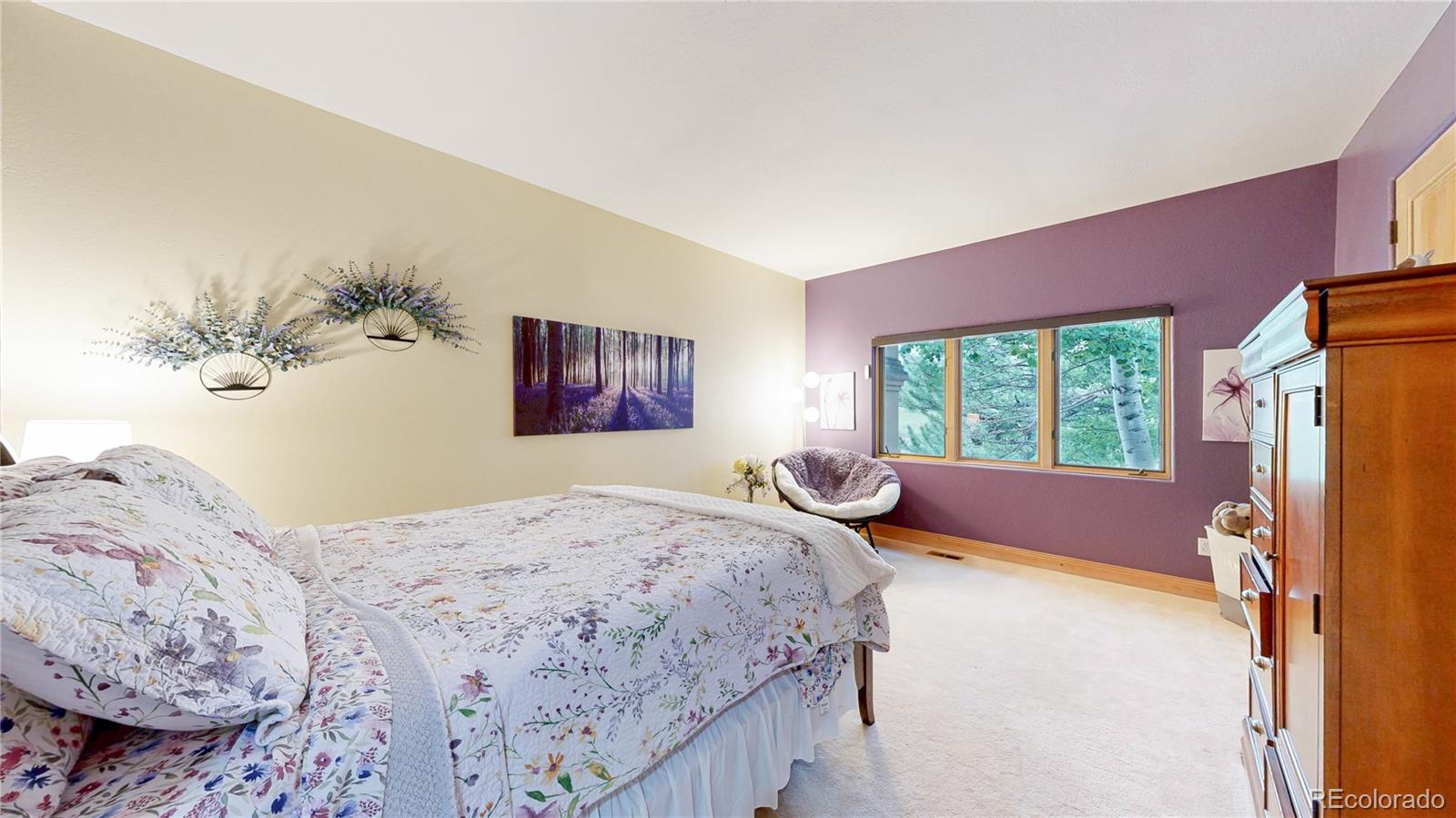 974 Spring Ranch Drive Golden, CO 80401 - Photo 28 of 50 a bedroom with a bed and a window