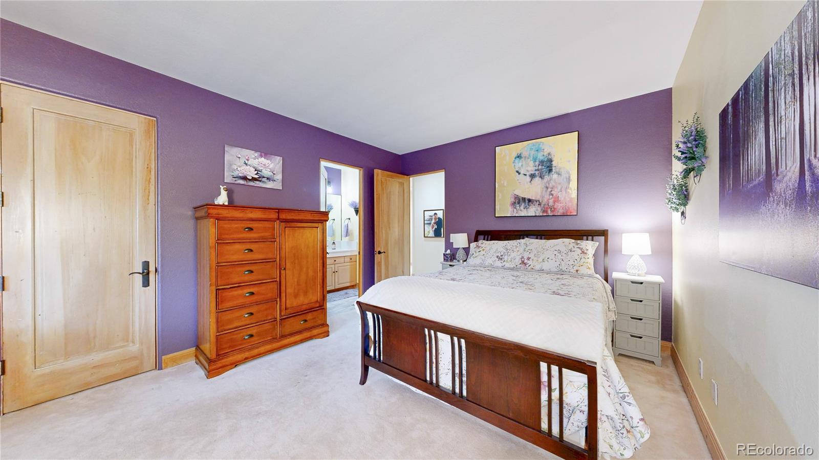 974 Spring Ranch Drive Golden, CO 80401 - Photo 29 of 50 a bedroom with a bed and a dresser