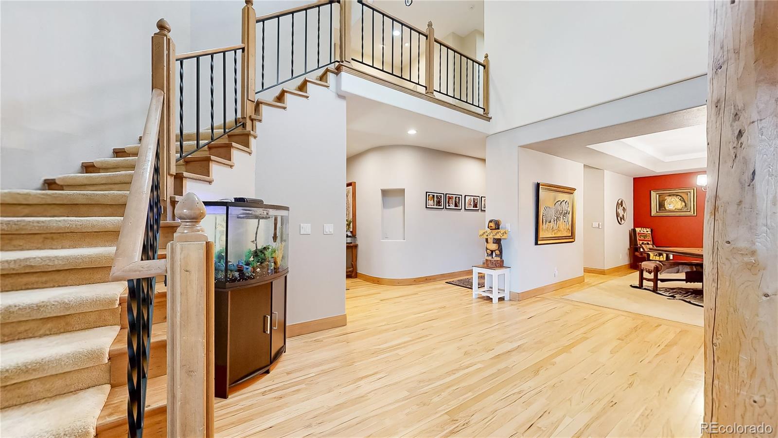974 Spring Ranch Drive Golden, CO 80401 - Photo 3 of 50 a view of entryway and hall with wooden floor