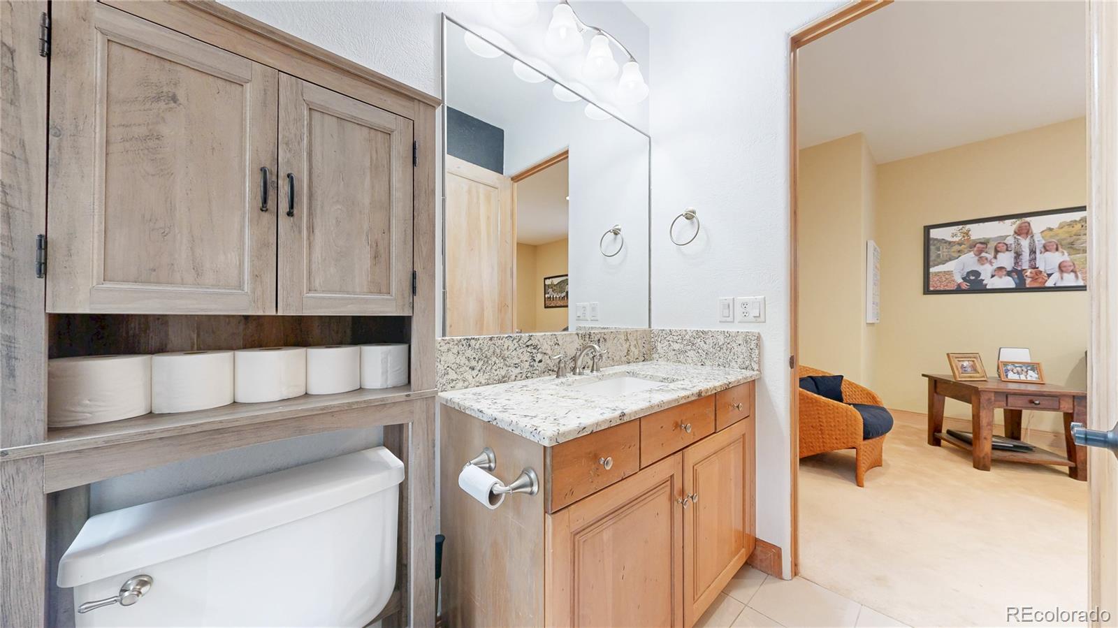 974 Spring Ranch Drive Golden, CO 80401 - Photo 36 of 50 a bathroom with a sink toilet and vanity