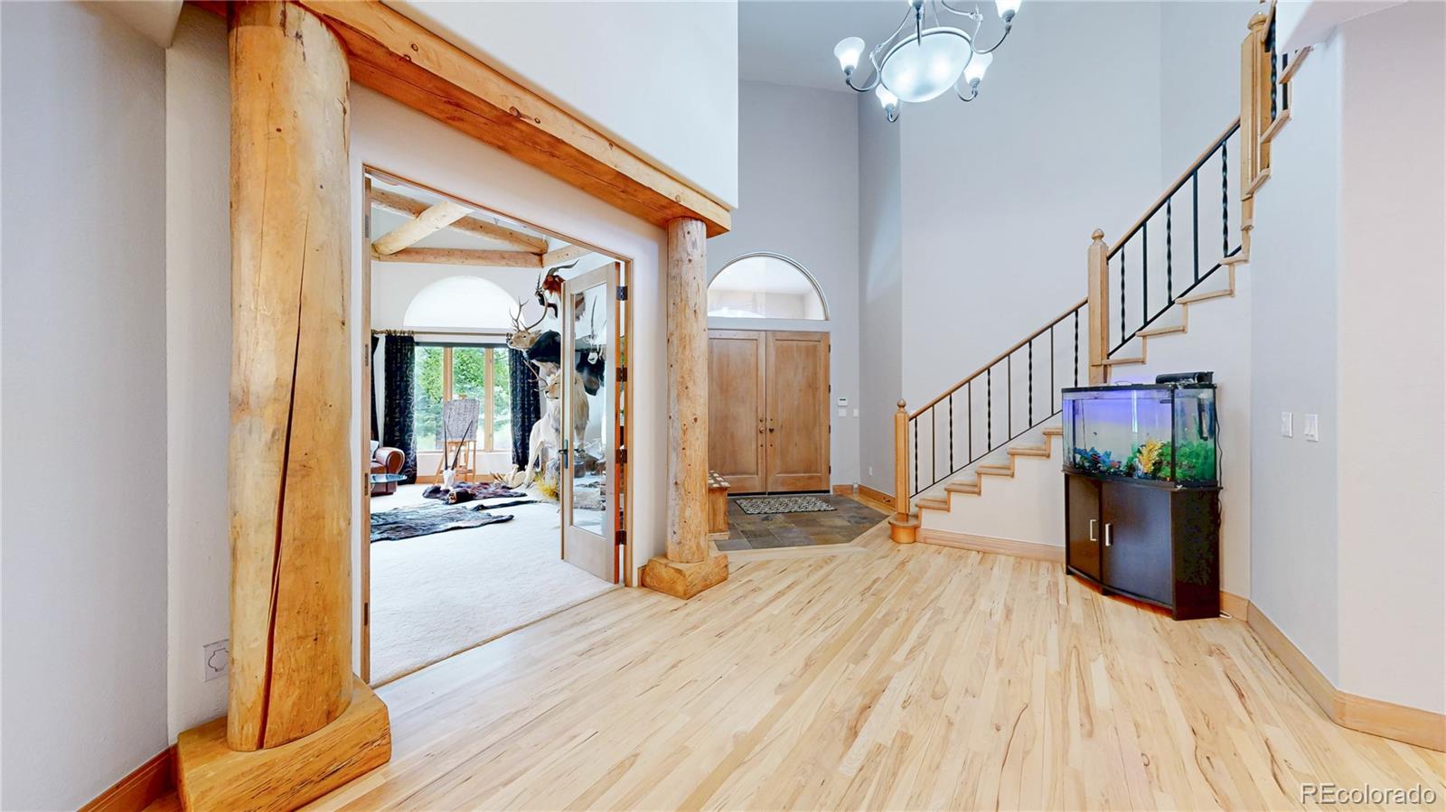 974 Spring Ranch Drive Golden, CO 80401 - Photo 4 of 50 a view of entryway and hall with wooden floor
